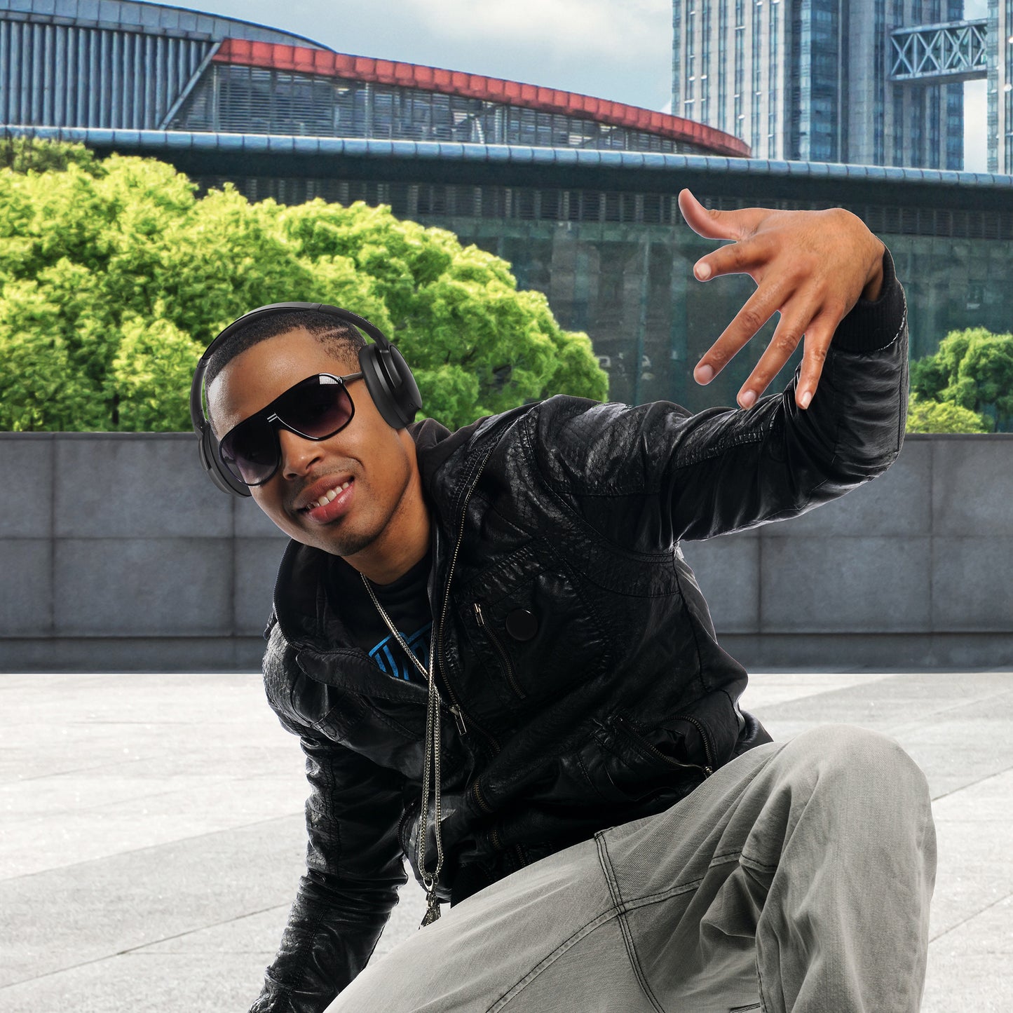 Photo of Morpheus 360 Krave ANC showing a Young African American man wearing Krave ANC headphones while listening and dancing to music.