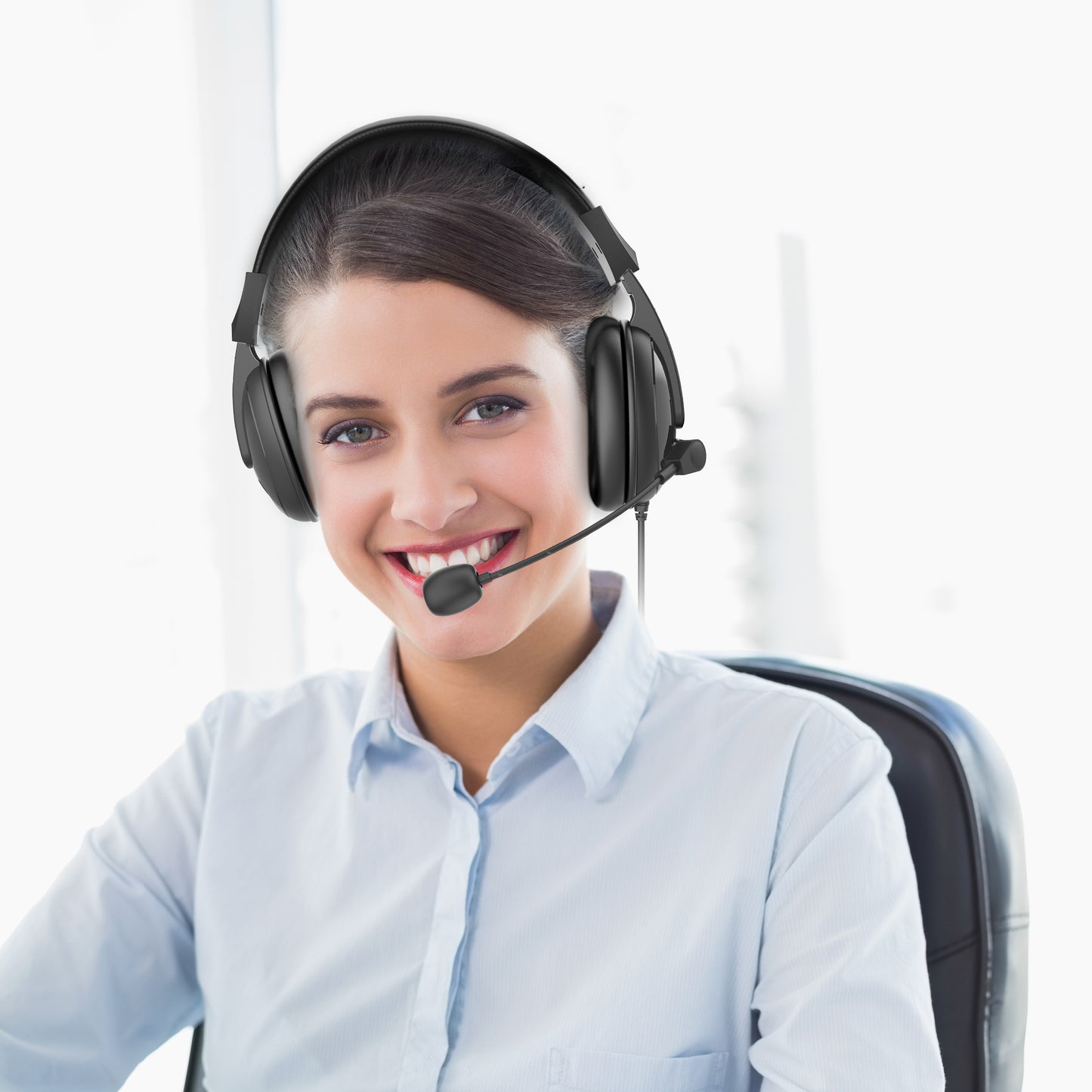 Businesswoman in an office wearing her Basic MM Headset with Boom Microphone and speaking to a customer.